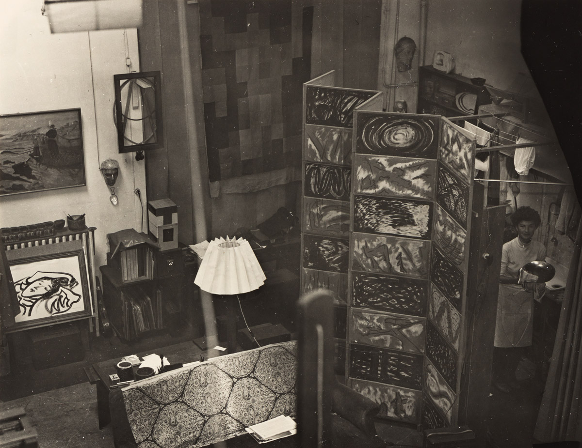 MAN RAY (1890-1976) The studio on rue Férou featuring a painted screen by Man Ray, titled The Twenty Days and Nights of Juliet.